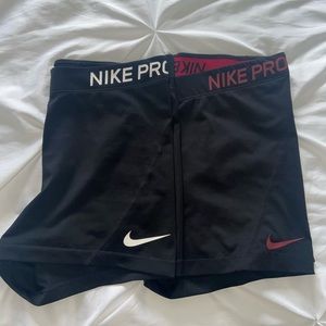 Two black Nike pro women’s athletic shorts (medium)